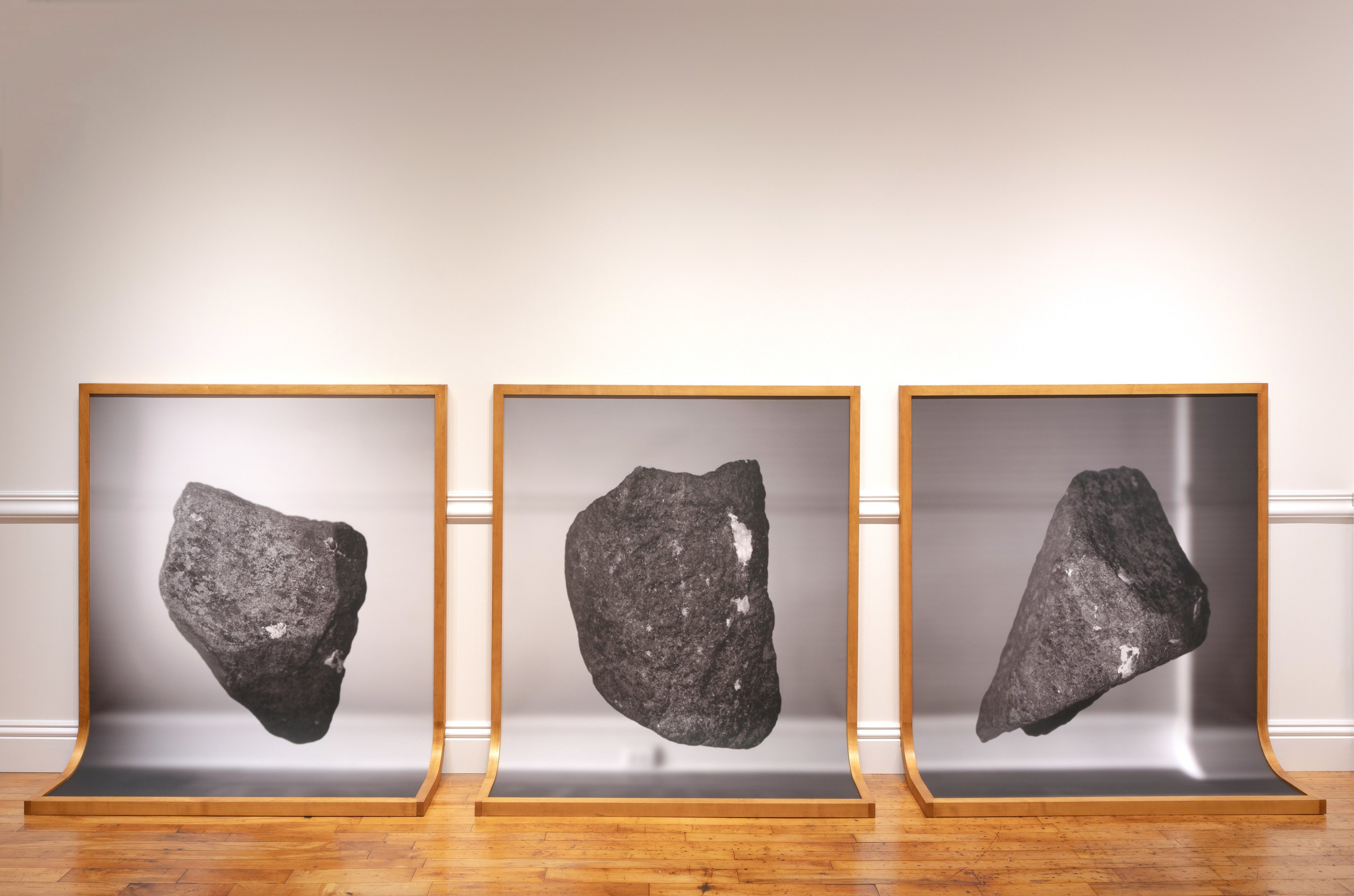 3 framed prints curving to become the floor and the wall.